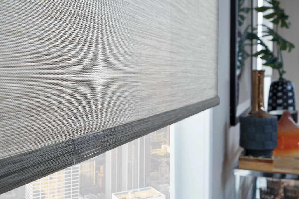 Solar shade in a bright living room showing view preservation with glare reduction