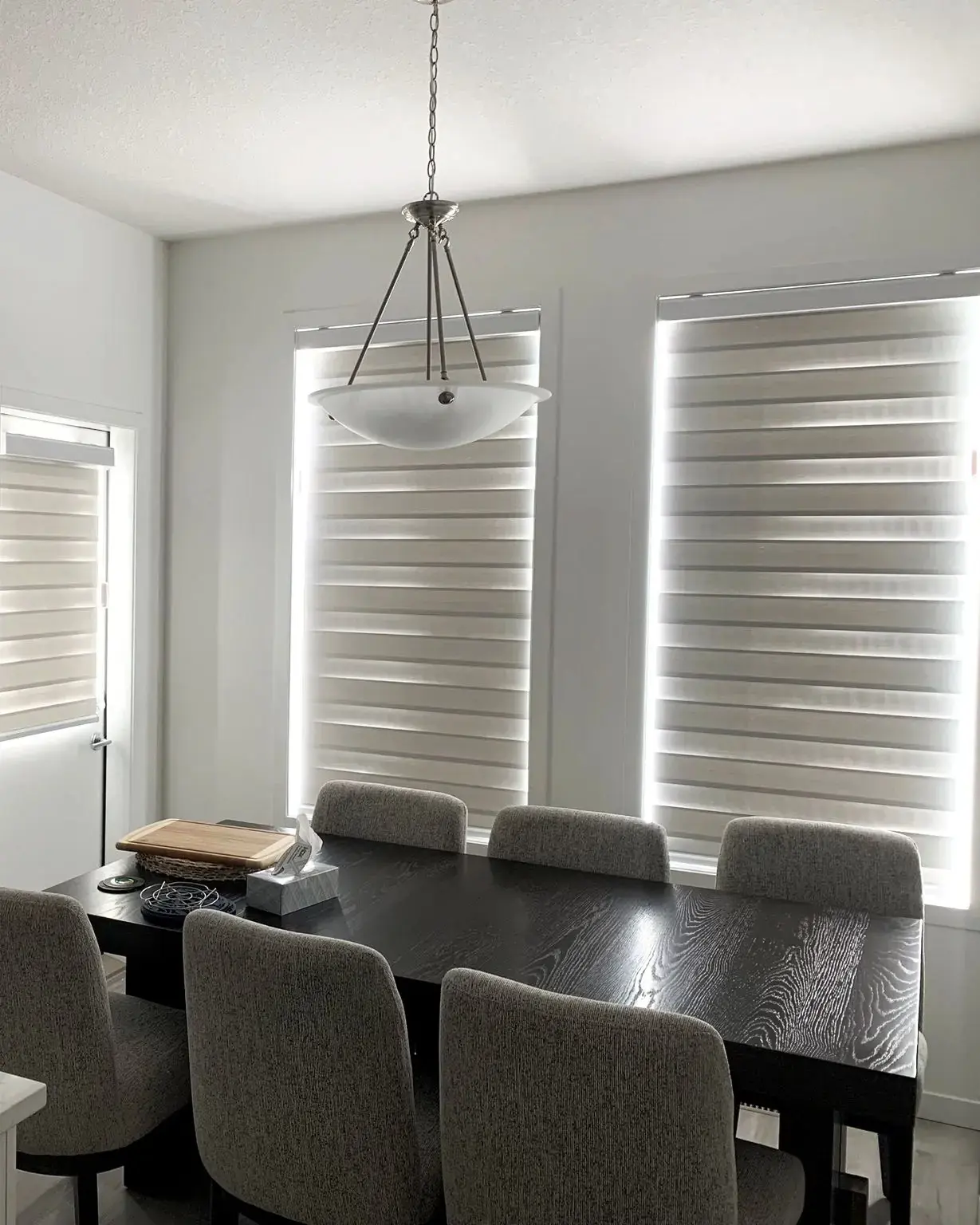 Zebra blinds in a modern living room showing the alternating band effect